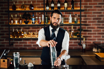 caucasian bartender preparing cocktails in bar