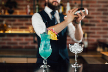 barman preparing cocktail in bar