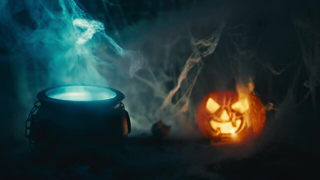 Pot with smoke coming out and Halloween pumpkin