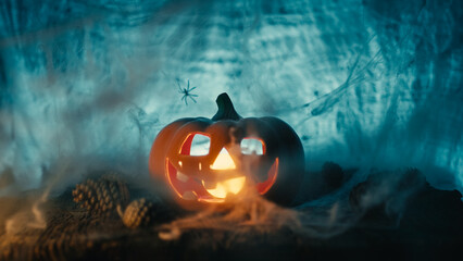 Terrible halloween party with pumpkin and spider on the cobweb