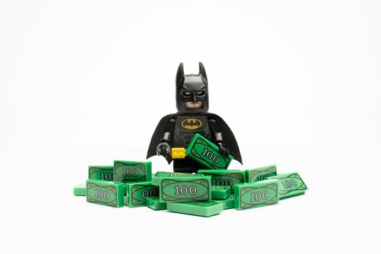Lego batman sitting on a pile of lego money stock photography and images
