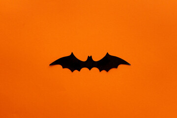 Fototapeta premium orange halloween background with a bat in the middle