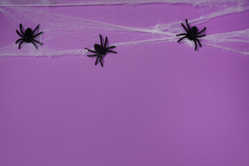Halloween card with spiders, purple background. Happy halloween banner mockup