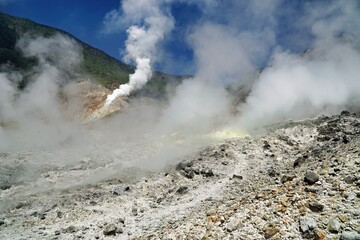 Fototapeta na wymiar Smoking volcanoes and indonesia, mountains, burnt forest, volcanic lake
