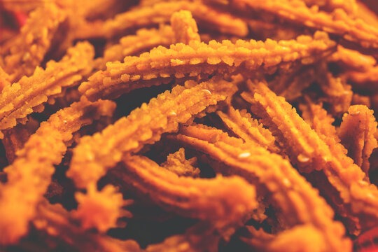 Bhajni chakli sticks or crunchy murukku snack made using diwali festival, favourite munching food