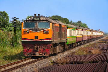 Naklejka premium Passenger train by diesel locomotive at the railway station. 