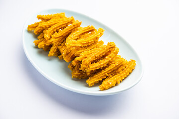 Bhajni chakli sticks or crunchy murukku snack made using diwali festival, favourite munching food