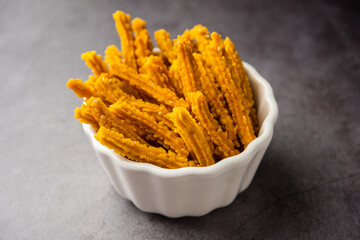 Bhajni chakli sticks or crunchy murukku snack made using diwali festival, favourite munching food