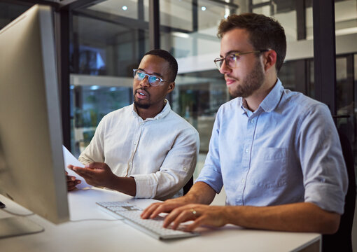 Marketing Team At Night, Working On Digital Advertising Project With Teamwork And Collaboration In The Office On Computer. A Smart Strategy, Planning And Dedication Lead To Career Success In Business