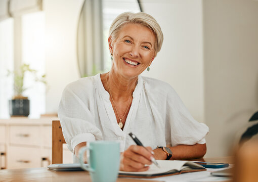 Freelance writer, senior woman and writing in notebook or planner feeling happy, relax and enjoying retirement to be creative and organized at home. Portrait of old lady sitting in Australia house