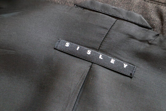 Label of a SISLEY jacket. Sisley is an Italian fashion brand of Benetton Group S.r.l. - Itay
