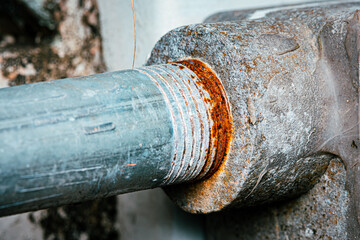 Close-up Rusty on thread of connection galvanized pipe, Electric wire pipe in outdoor, selective...