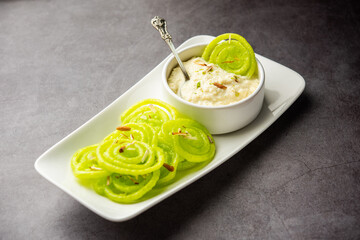 Rabdi Jalebi - Green jilebi or imarati with Rabri made from condensing milk, Indian dessert