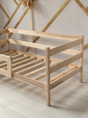 Wooden baby cot. Natural. Bed in the children's room. Natural eco-friendly furniture