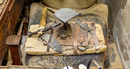 Traditional tools for shoe repair, hammer, cobbler's anvil, etc.