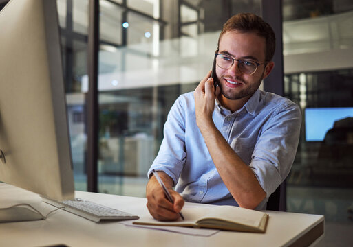 Business Phone Call, Internet Research And Businessman Planning Idea On Computer In Dark Office At Night. Corporate Manager Writing Notes And Speaking On Cellphone For Strategy During Late Overtime