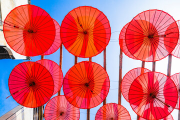 Fototapeta na wymiar Red oiled paper umbrella in Huangleng scenic area, Wuyuan, Jiangxi
