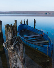 close up shot of a blue boat looking out on the water in Dorset