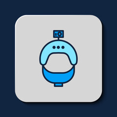 Filled outline Helmet and action camera icon isolated on blue background. Vector