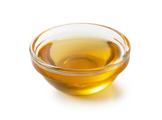 Honey in glass bowl on white background.