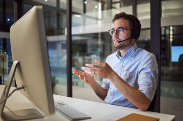 Man, work and call center in office for telemarketing with pc on desk give support to client in...