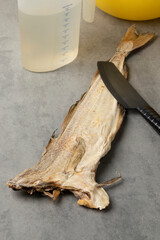 Single dried stockfish ready to soak in water  before cooking