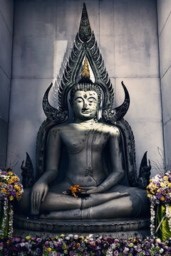 Buddha sculpture sitting in meditation in temple in Thaliand