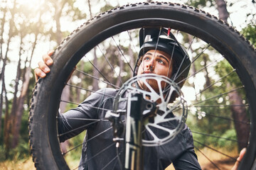 Bicycle, wheel and tyre in forest with man fix problem in zoom or closeup of rim. Cyclist, bike and...