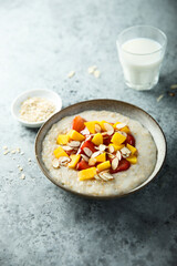 Homemade oatmeal porridge with strawberry and mango