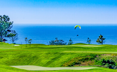 Hand glider Flying Over Torrey Pines Golf Course