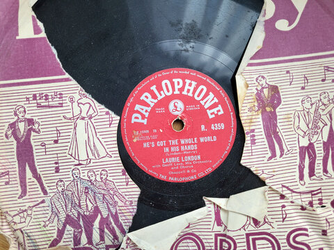 London, UK: September 28, 2022: Parlophone Vinyl Recording of 'He's Got the Whole World in His Hands' by Laurie London. The British branch of Parlophone was founded in 1923.