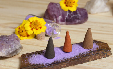 Incense Cones on Stone Slab With Crystals and Flowers