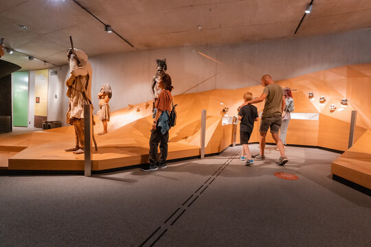 22 July 2022, Dusseldorf, Germany: Parents with children take a tour of the Neanderthal Museum of the Ancestors of Homo Sapiens and Evolution. Teaching science and anthropology
