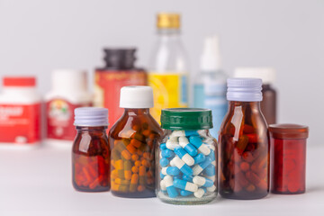 group of medicine bottle and pills