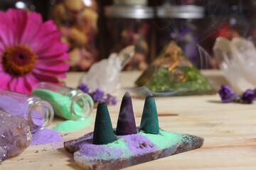 Incense Cones on Stone Slab With Crystals and Flowers