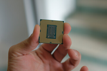 Man show an hi tech desktop pc cpu part,computer components chip shortage