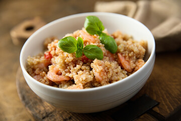 Healthy quinoa bowl with shrimps and basil