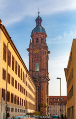 The highest church tower in Würzburg, seen from the street Schönthalstraße. The tower with a...