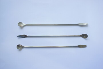 stainless laboratory spoon spatula isolated on white background