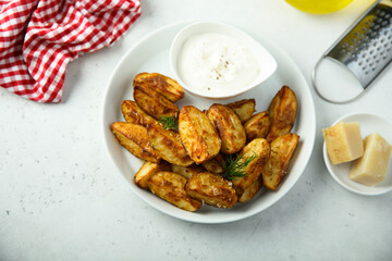 Roasted potato wedges with cheese and spices