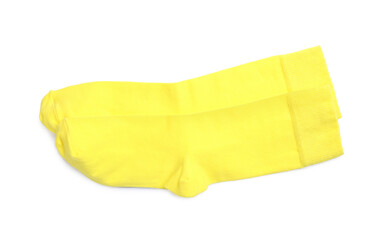 Pair of yellow socks on white background, top view