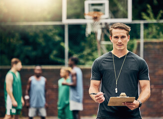 Basketball coach on court training team for game, tournament and competition outside. Confident, trainer and man focus on workout or teamwork to prepare, motivation and plan play strategy at practice © C Coetzee/peopleimages.com