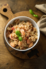 Healthy quinoa bowl with shrimps and basil