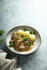 Homemade beef ragout with potato dumplings