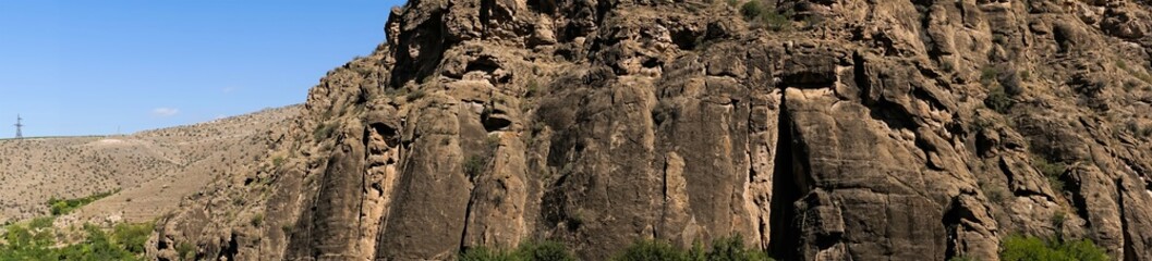 Panoramic photo of a rock in the mountains of the Caucasus.