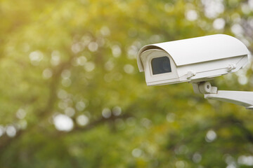 CCTV with water proof cover installing on wall for crime protection. Digital security camera...