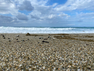 Sandy beach sky and waves