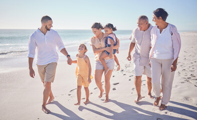Big family walking on beach holding hands for love, support and care on summer vacation, holiday in sand. Wellness, health and child development with grandparents and children or kids by ocean waves