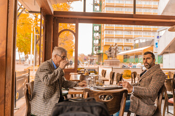 Sitting together in the cafe and looking at something