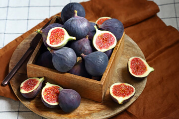 Fresh ripe figs in a wooden box.
